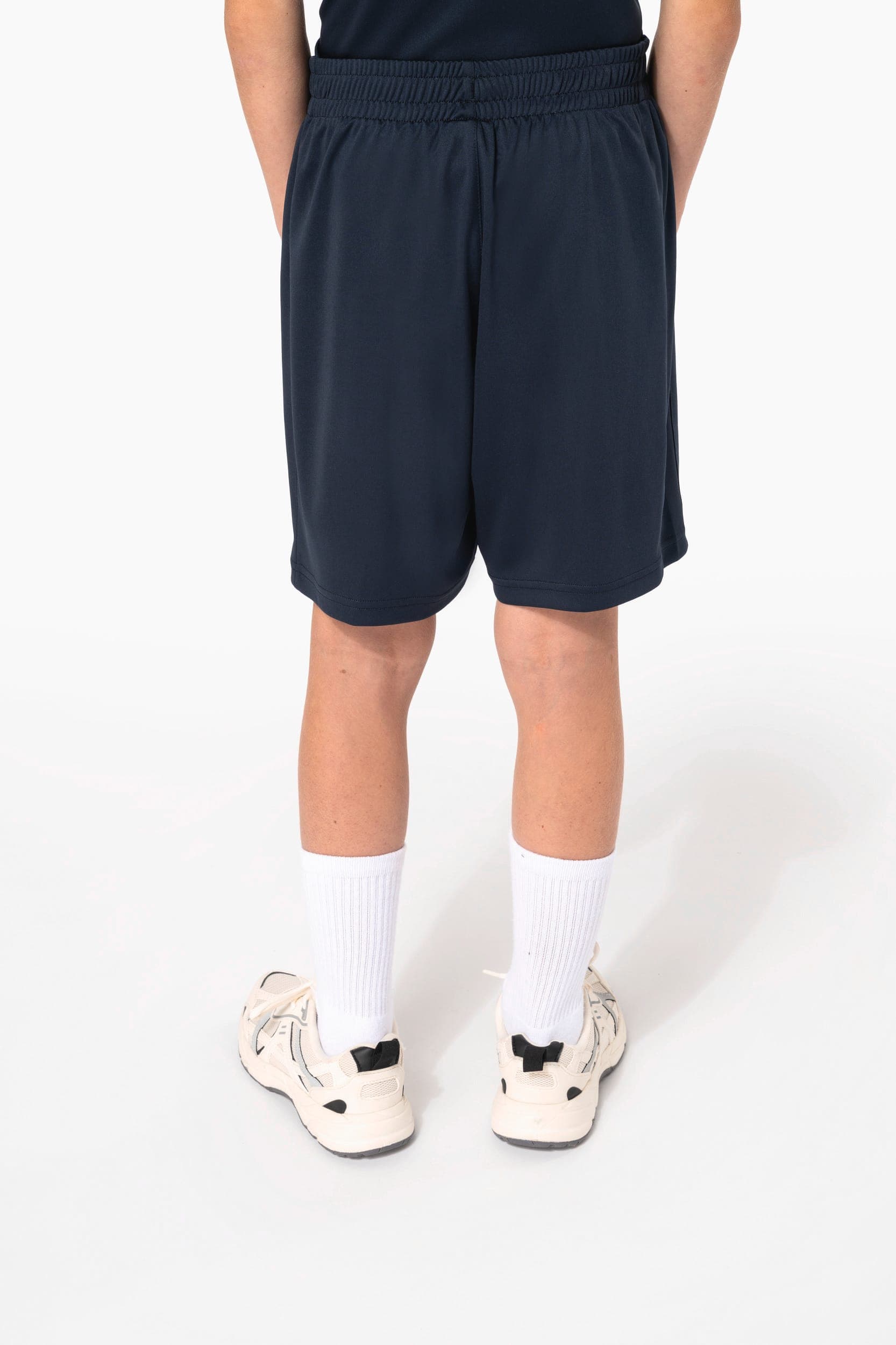 Short multisport en polyester enfant en situation