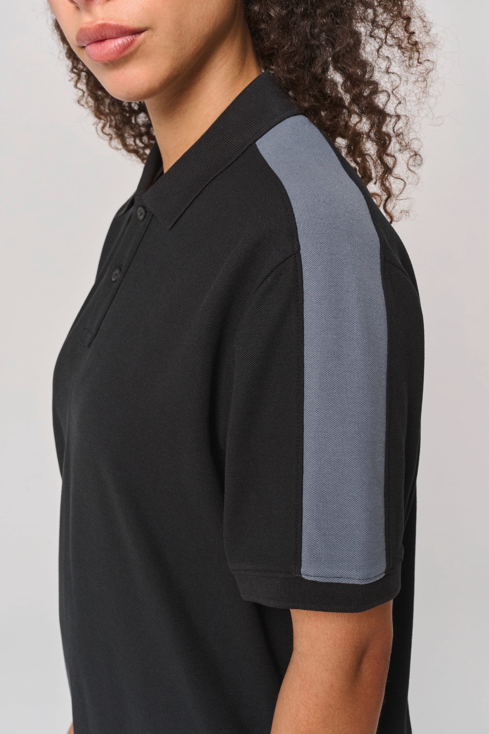Polo teamwear unisexe en situation