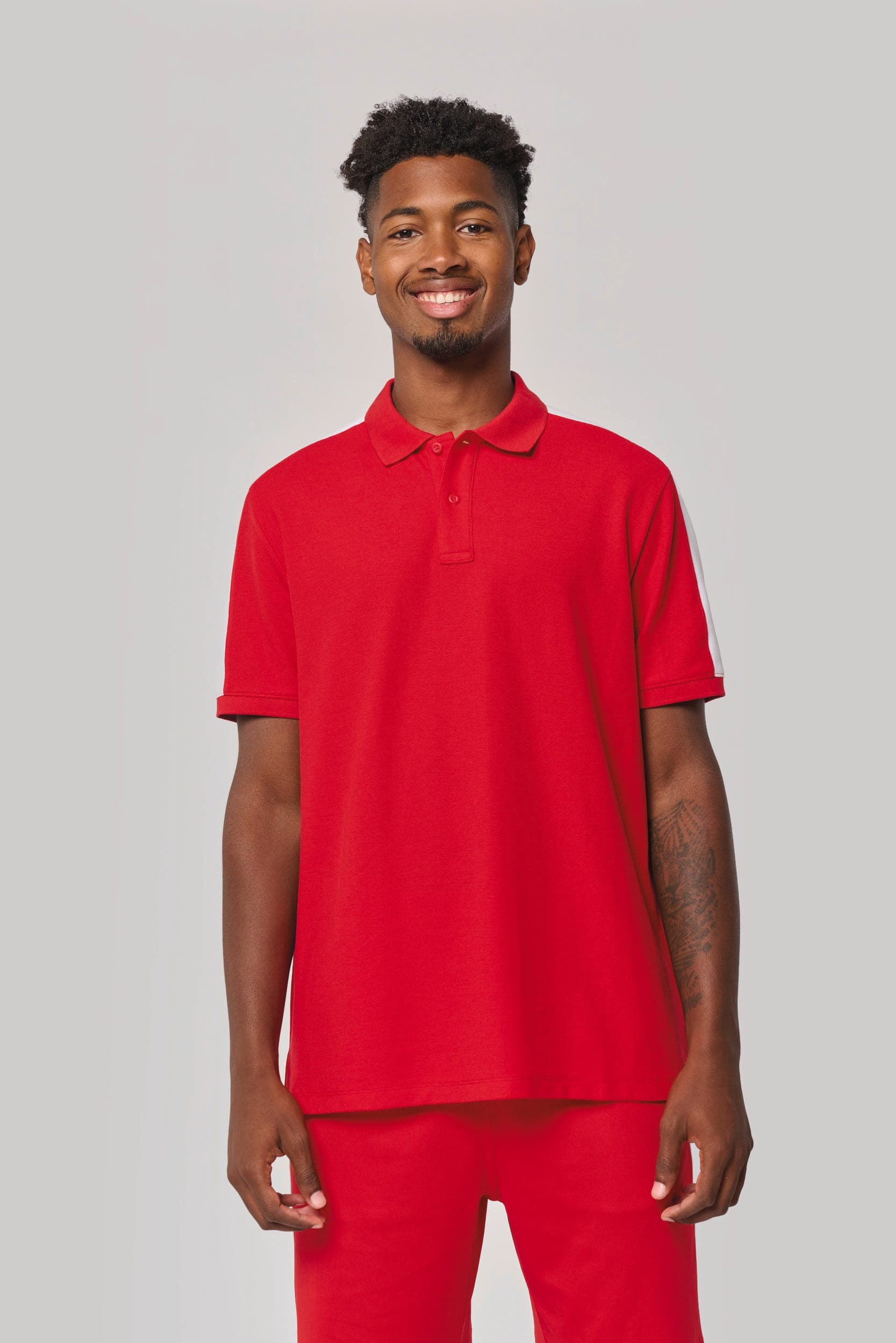 Polo teamwear unisexe en situation