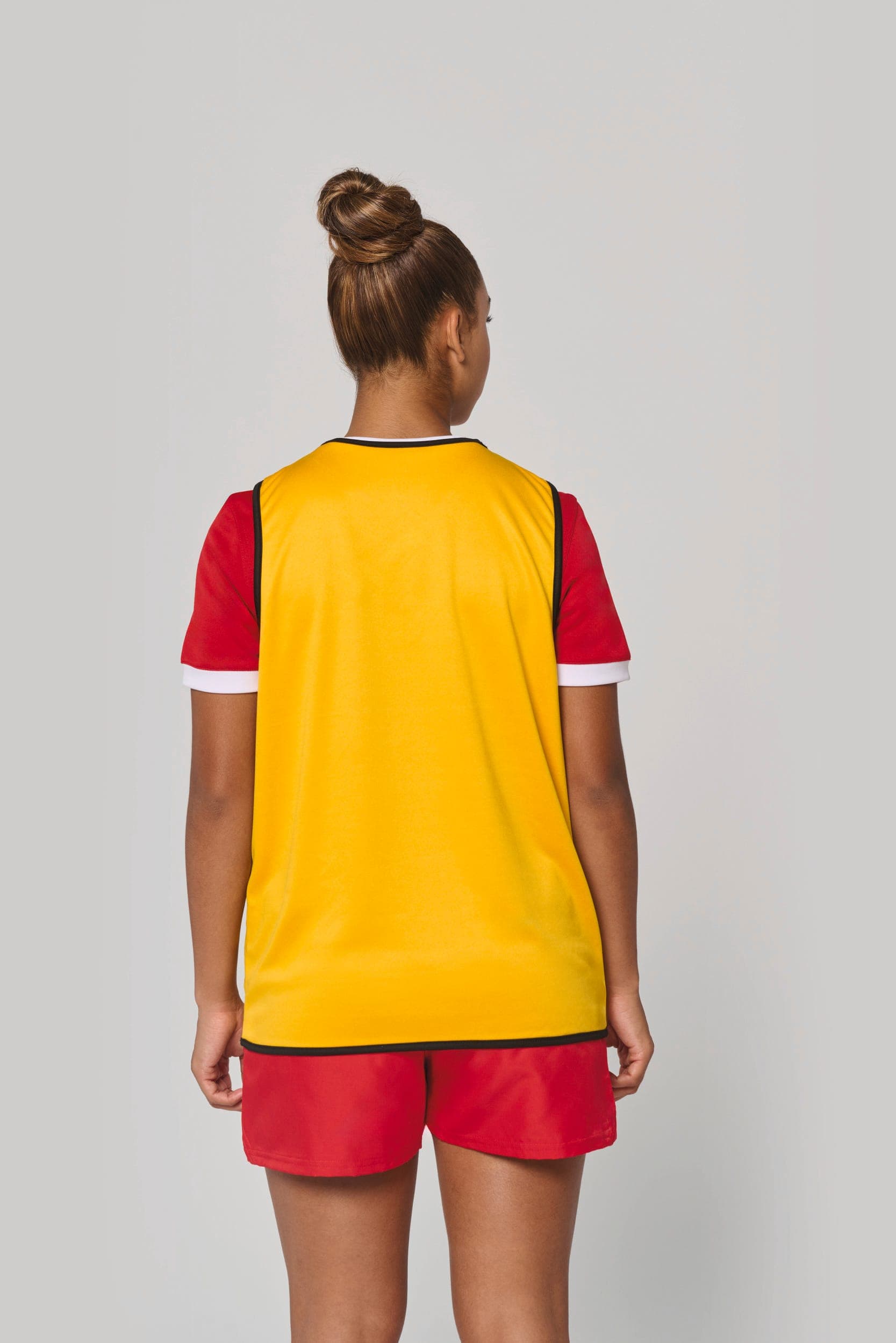 Chasuble de rugby réversible unisexe en situation